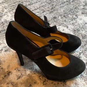 Black Nine West high heel pumps with strap. Some wear. Size 7.